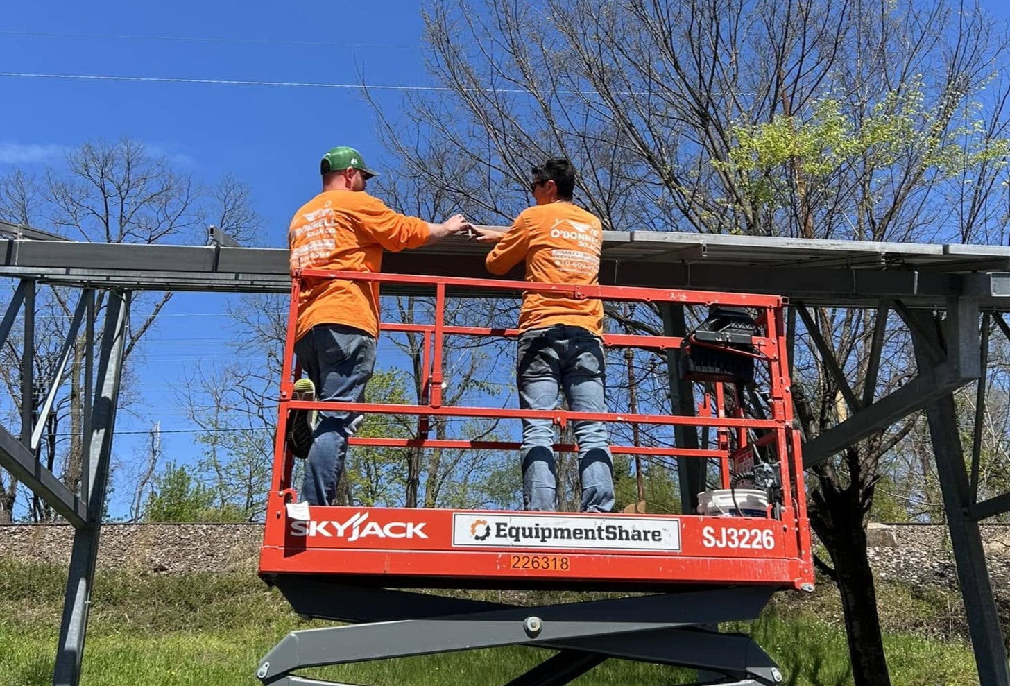 O'Donnell Solar team installing a large solar panel