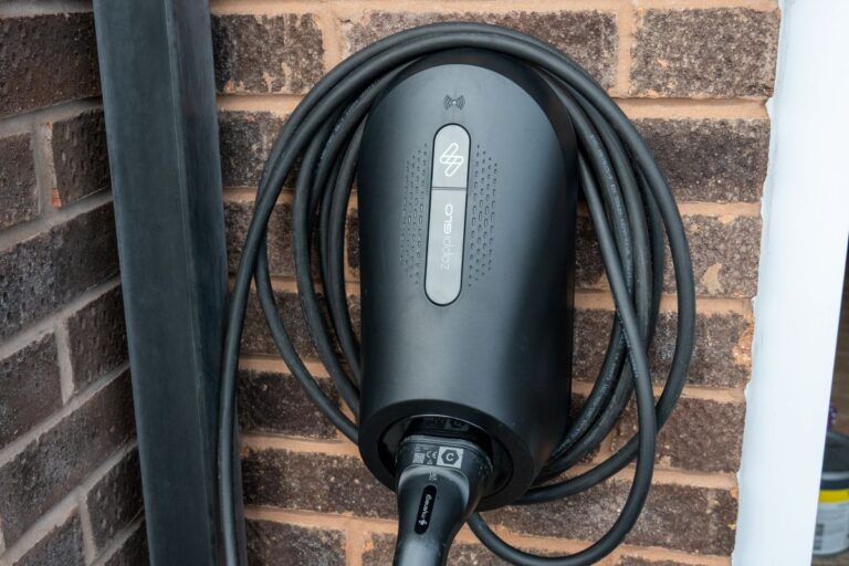 Electric Vehicle Charging Point Installed on a Residential Brick Wall