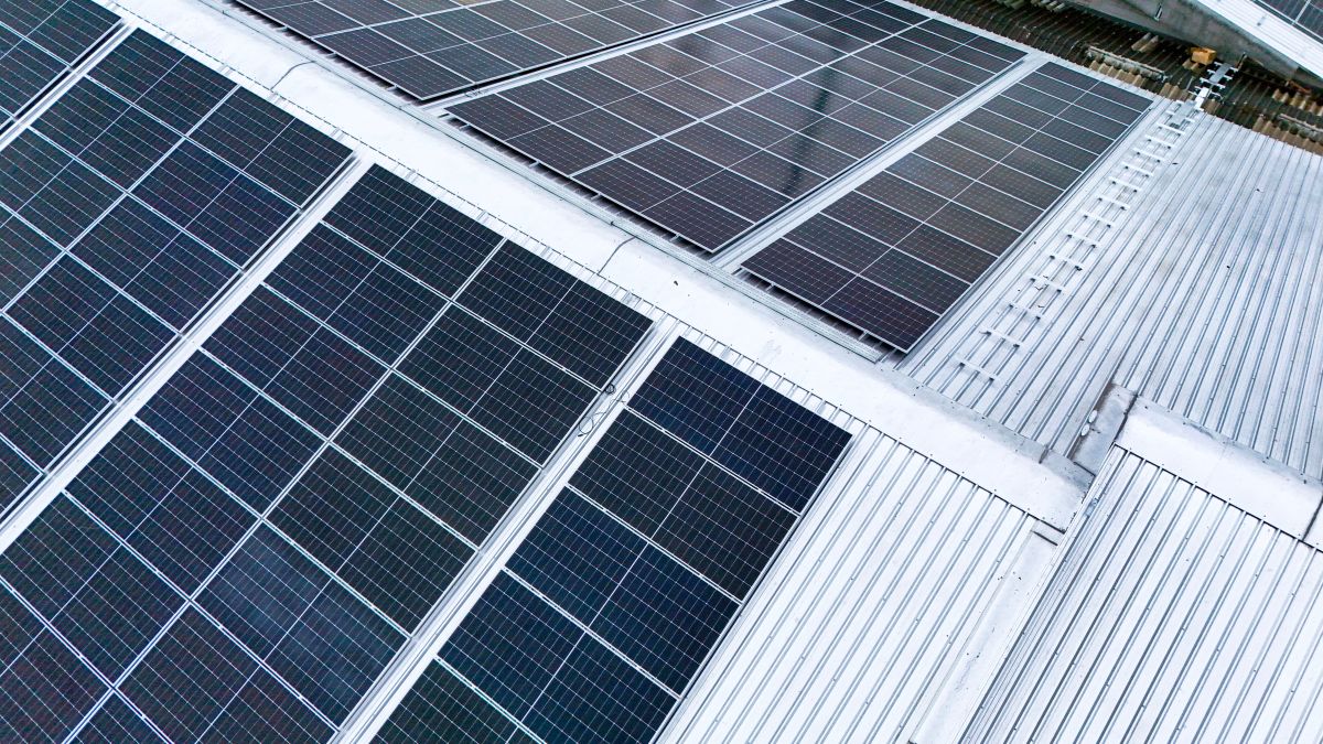 solar panels installed on the metal roof of a commercial building