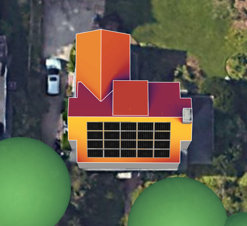 An aerial view of a house with solar panels, showcasing the economic benefits of harnessing solar energy.
